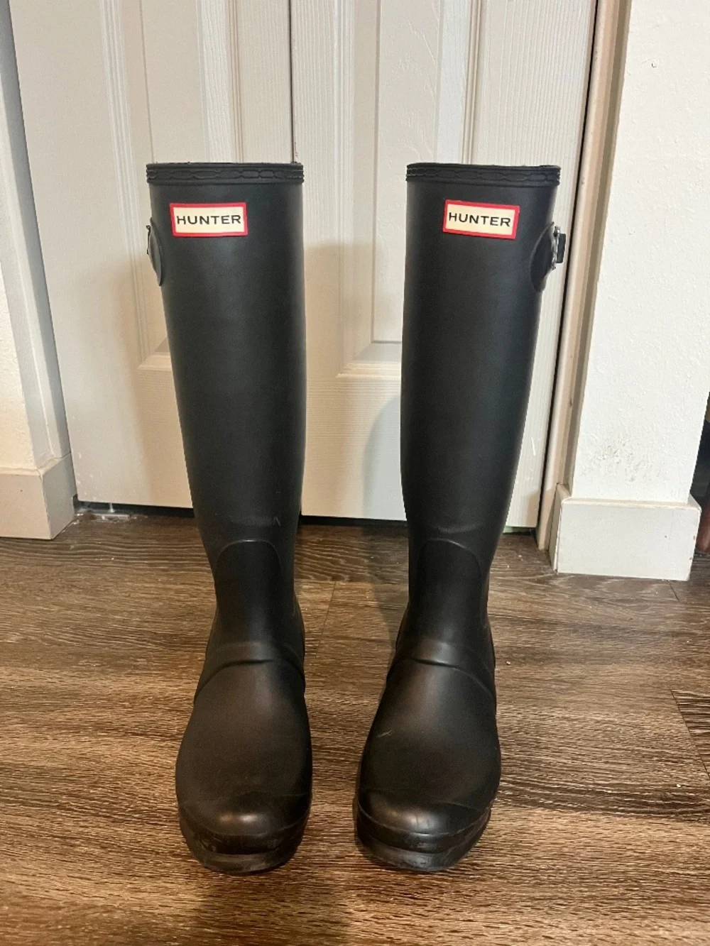 Women’s tall black hunter boots with socks